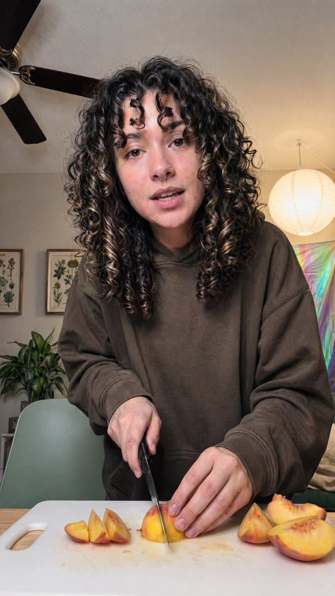 Social Media Post - Cozy Indoor Peach Slicing Portrait generated image example